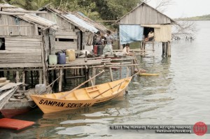 The school boat outside the homes of "anak laut", the sea tribe children.